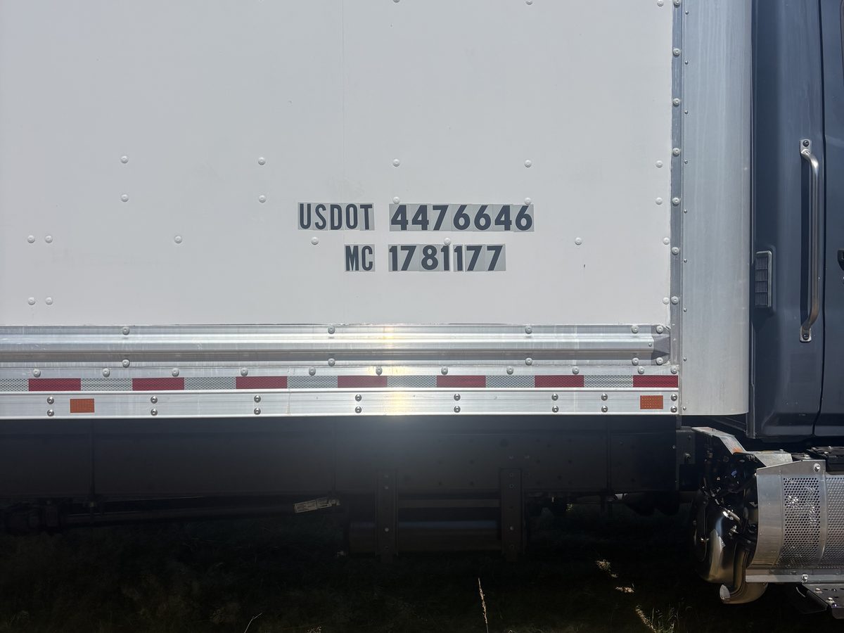 USDOT 4476646 and MC 1781177 lettered on the side of the truck